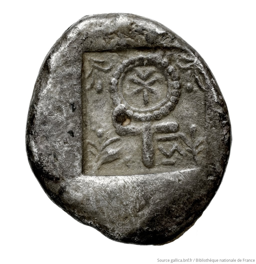Reverse 'SilCoinCy A4439, Fonds général, acc.no.: . Silver coin of king Evelthon's successors of Salamis 500 - 478 BC. Weight: 11.03g, Axis: 4h, Diameter: 24mm. Obverse type: ram lying l.. Obverse symbol: -. Obverse legend: e-u-we-le-to-to-se in Cypriot syllabic. Reverse type: Ankh, the ring formed of pellets ranged about a linear circle; in circle, inscription: the whole in incuse square, from corners of which project sprays of three leaves.. Reverse symbol: -. Reverse legend: ku-na in Cypriot syllabic.