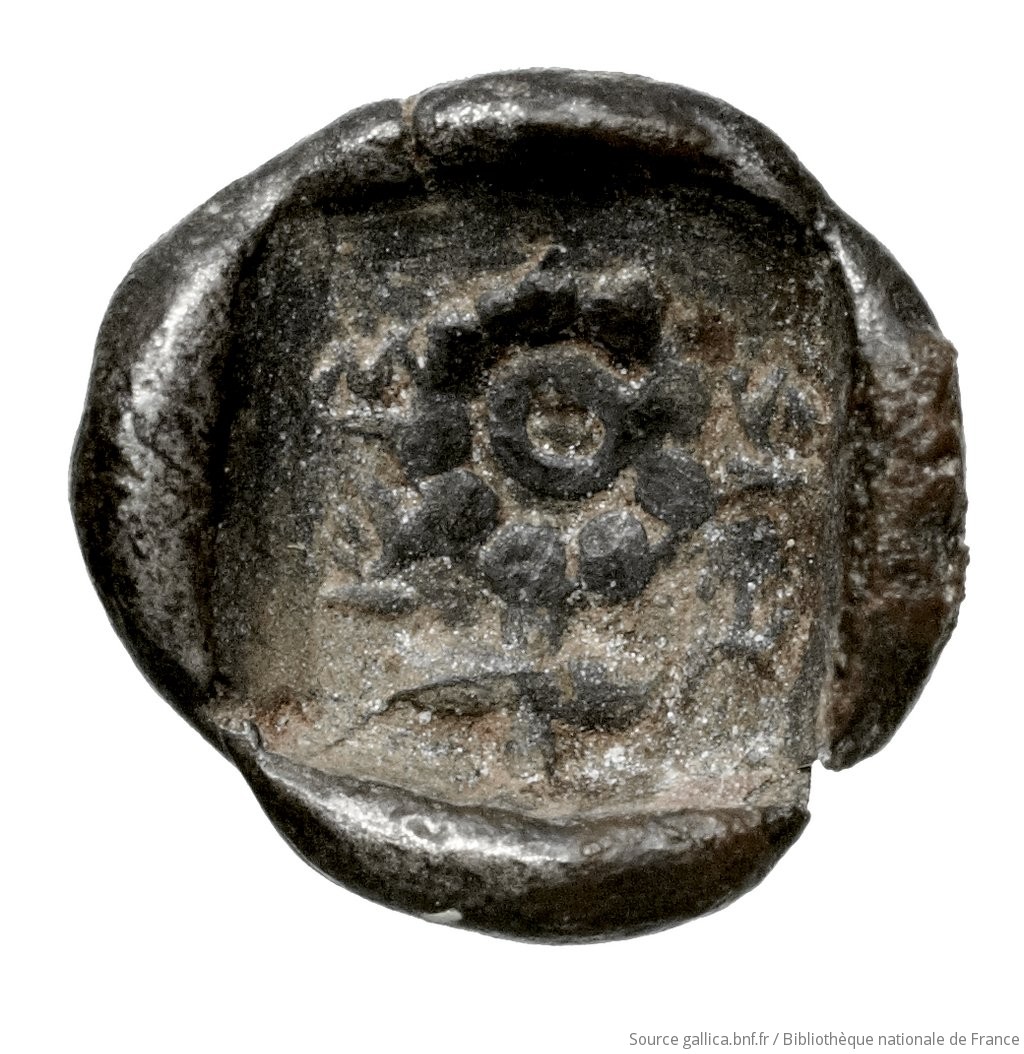 Reverse 'SilCoinCy A4446, Fonds général, acc.no.: Babelon 574A. Silver coin of king Nikodamos of Salamis 450 BC - . Weight: 0.77g, Axis: 9h, Diameter: 9mm. Obverse type: ram's head left. Obverse symbol: -. Obverse legend: - in -. Reverse type: Ankh, the ring formed of pellets ranged about a linear circle; in circle, cypriot syllabic sign. Signs around the corners. Reverse symbol: -. Reverse legend: ni-mi-la-se in Cypriot syllabic. 'Catalogue des monnaies grecques de la Bibliothèque Nationale: les Perses Achéménides, les satrapes et les dynastes tributaires de leur empire: Cypre et la Phénicie'.