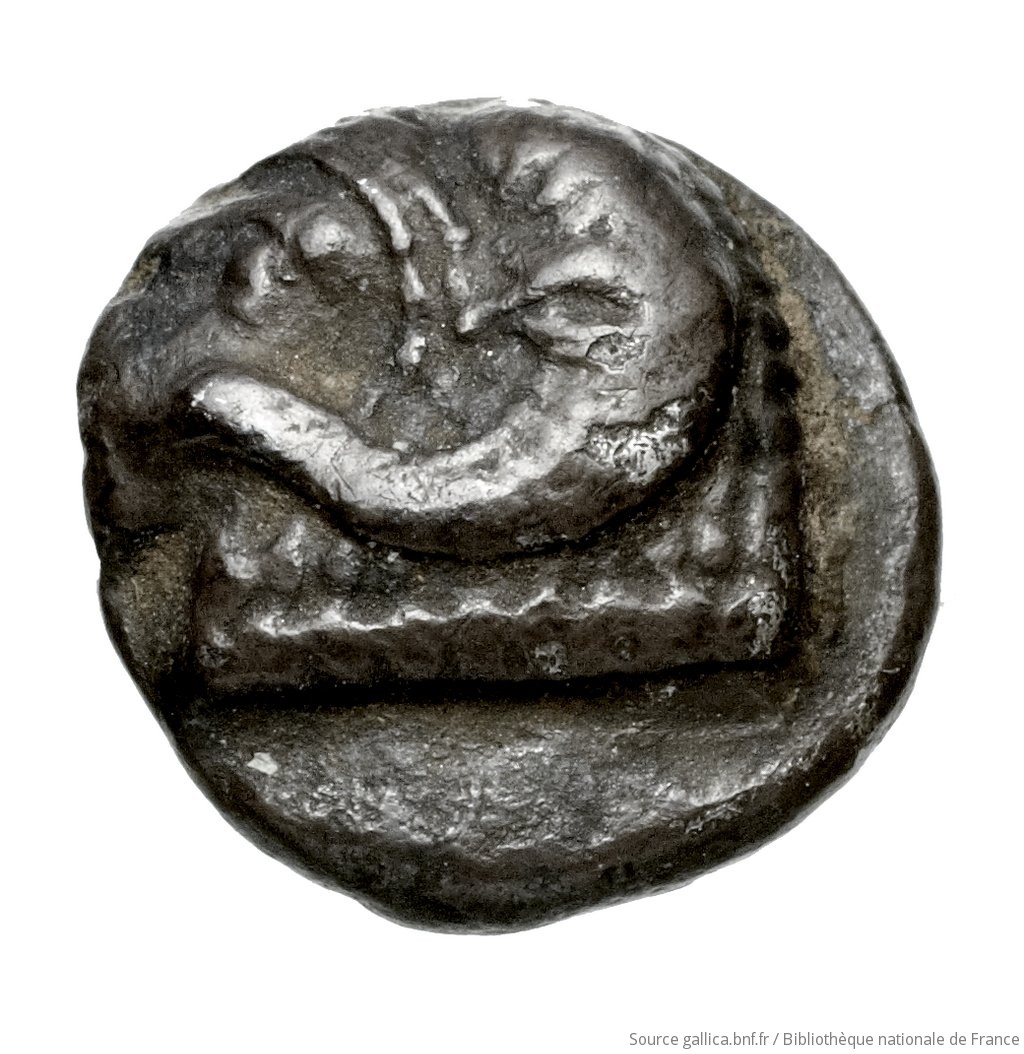 Obverse 'SilCoinCy A4447, Waddington, acc.no.: Babelon 574B. Silver coin of king Nikodamos of Salamis 450 BC - . Weight: 0.86g, Axis: 11h, Diameter: 9mm. Obverse type: ram's head left. Obverse symbol: -. Obverse legend: - in -. Reverse type: Ankh, the ring formed of pellets ranged about a linear circle; in circle, cypriot syllabic sign. Signs around the corners. Reverse symbol: -. Reverse legend: ni-mi-la-se in Cypriot syllabic. 'Catalogue des monnaies grecques de la Bibliothèque Nationale: les Perses Achéménides, les satrapes et les dynastes tributaires de leur empire: Cypre et la Phénicie', 'Inventaire de la Collection Waddington'.