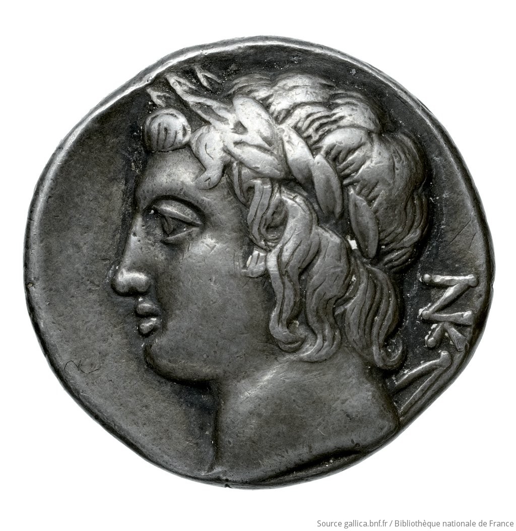 Reverse 'SilCoinCy A4512, Fonds général, acc.no.: Babelon 636. Silver coin of king Nikokreon of Salamis 331 - 310/9 BC. Weight: 6.34g, Axis: 11h, Diameter: 18mm. Obverse type: Bust of Aphrodite right, wearing a turreted crown. Obverse symbol: -. Obverse legend: ΒΑ in Greek. Reverse type: Head of Apollo with short hair left, wearing a laurel wreath; bow behind his back. Reverse symbol: -. Reverse legend: ΝΚ in Greek. 'Catalogue des monnaies grecques de la Bibliothèque Nationale: les Perses Achéménides, les satrapes et les dynastes tributaires de leur empire: Cypre et la Phénicie'.