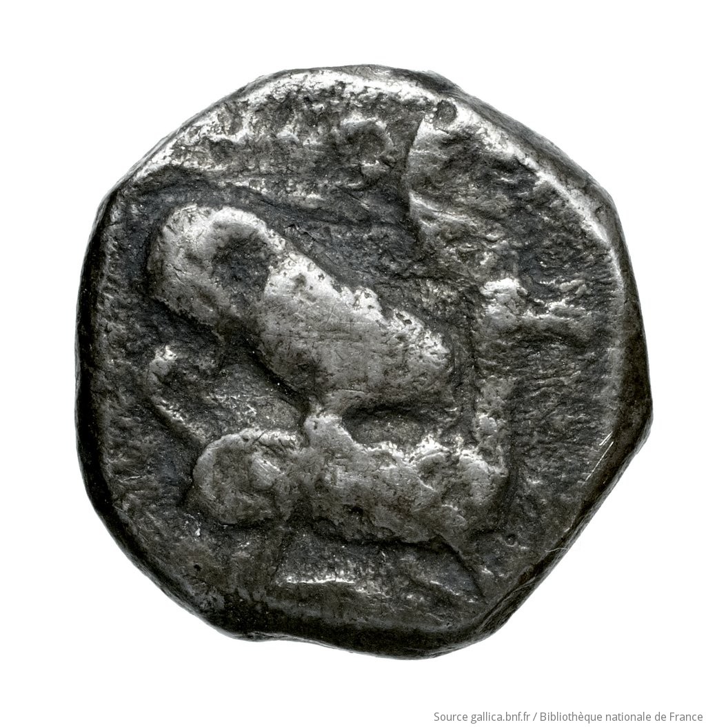 Reverse 'SilCoinCy A4538, Fonds général, acc.no.: Babelon 677. Silver coin of king Ozibaal of Kition 450 - 425 BC. Weight: 3.67g, Axis: 7h, Diameter: 14mm. Obverse type: Herakles, wearing lion's skin over head and hanging down his back, advancing to right; in outstretched left bow, in right his club raised over his head: border of dots.. Obverse symbol: -. Obverse legend: - in -. Reverse type: Lion right, bringing down stag right; dotted square within incuse square. Reverse symbol: -. Reverse legend: ' in Phoenician. 'Catalogue des monnaies grecques de la Bibliothèque Nationale: les Perses Achéménides, les satrapes et les dynastes tributaires de leur empire: Cypre et la Phénicie'.