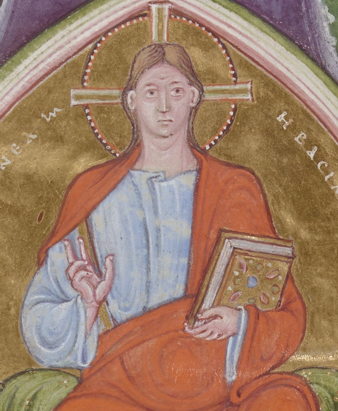 Jesus holds a book